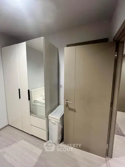 Modern bedroom with sleek wardrobe and minimalist design