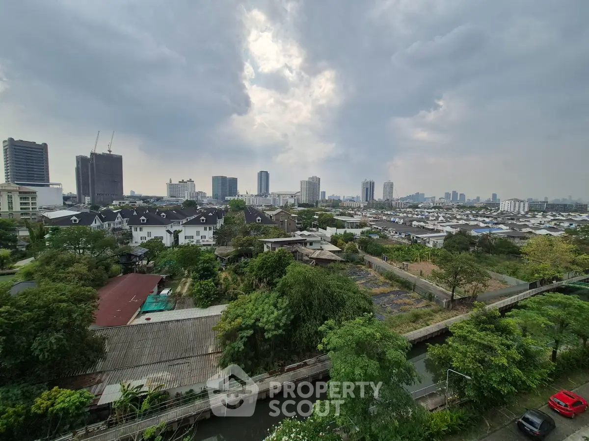 Stunning cityscape view with lush greenery and modern skyline, perfect for urban living enthusiasts.