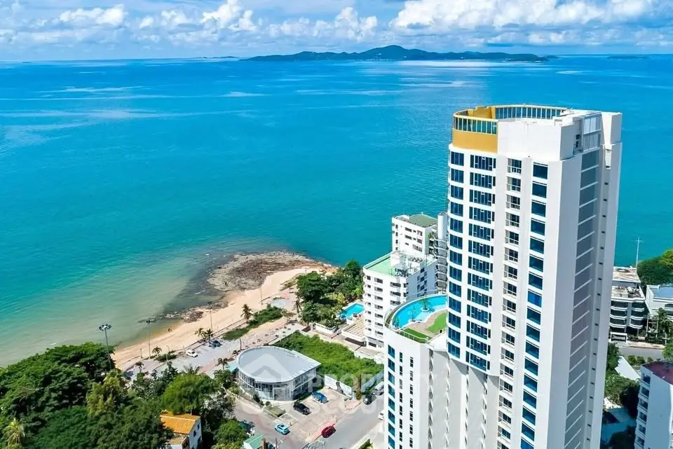 Stunning beachfront high-rise with panoramic ocean views and luxurious amenities.