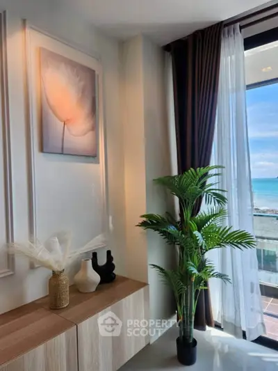 Stylish living room with ocean view, modern decor, and elegant furnishings.