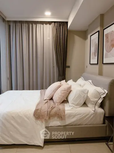 Cozy modern bedroom with elegant decor and soft lighting, perfect for relaxation and comfort.