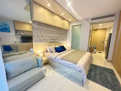 Modern bedroom with cozy decor and stylish lighting in a contemporary apartment.