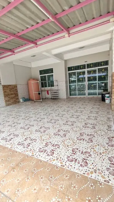 Spacious tiled garage with pink accents and ample storage space