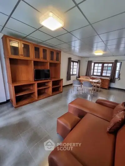 Spacious living room with modern furniture and ample natural light