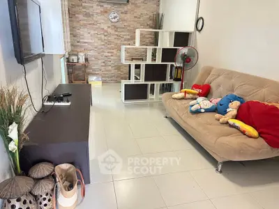 Cozy living room with modern decor and comfortable seating, perfect for relaxation and entertainment.