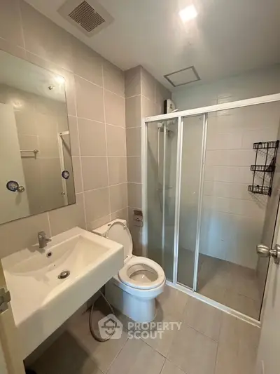 Modern bathroom with glass shower and sleek fixtures
