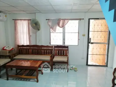 Cozy living room with wooden furniture and natural light
