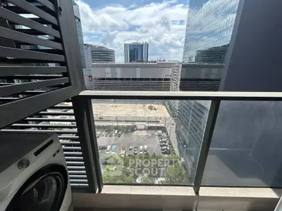 Modern urban balcony with city view and washing machine, perfect for city living.