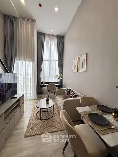 Modern living room with high ceilings and elegant decor