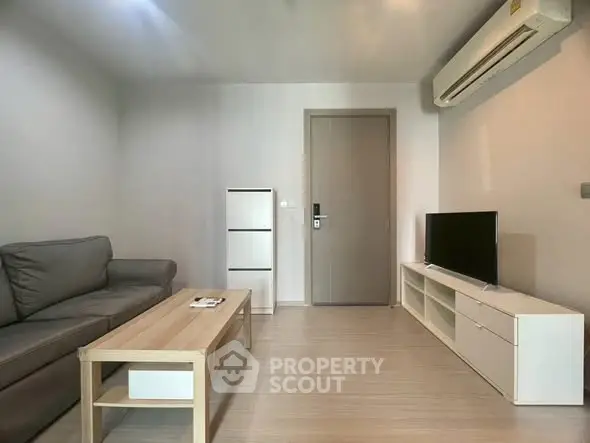 Modern living room with sleek furniture and air conditioning