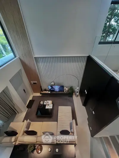 Luxurious modern living room with high ceilings and elegant decor