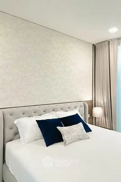 Luxurious bedroom with elegant decor and plush bedding, perfect for relaxation and comfort.
