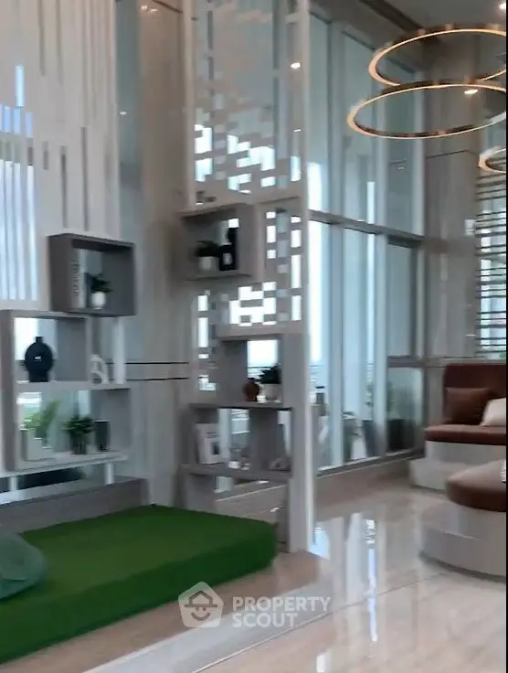 Luxurious modern living room with floor-to-ceiling windows and stylish decor