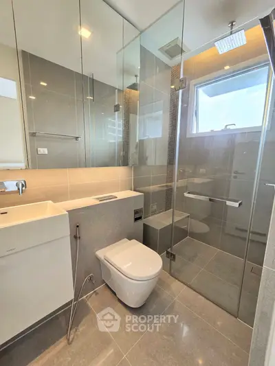 Modern bathroom with glass shower and sleek fixtures
