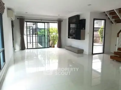 Spacious modern living room with large windows and sleek design