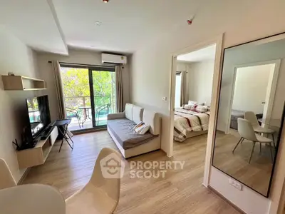 Modern living room with open layout and balcony view in stylish apartment