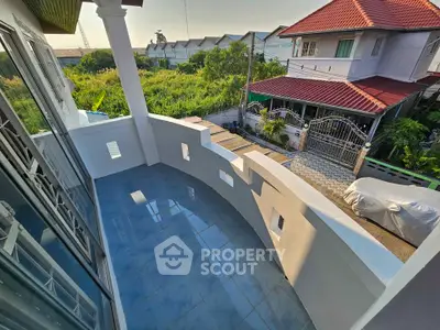 Spacious balcony with tiled flooring and scenic neighborhood view