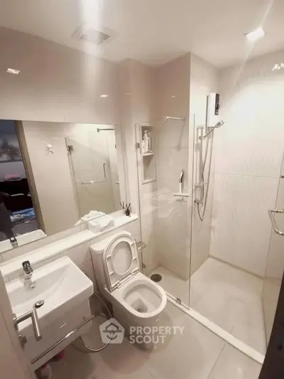 Modern bathroom with glass shower and sleek fixtures