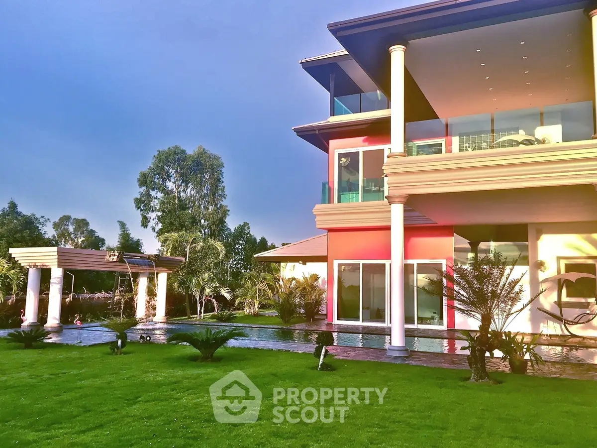 Luxurious modern villa with expansive garden and elegant architecture, perfect for upscale living.