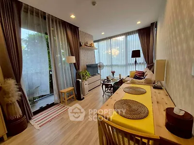 Charming living room with modern decor and large windows for natural light