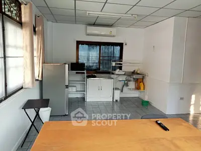 Spacious kitchen with modern appliances and ample natural light