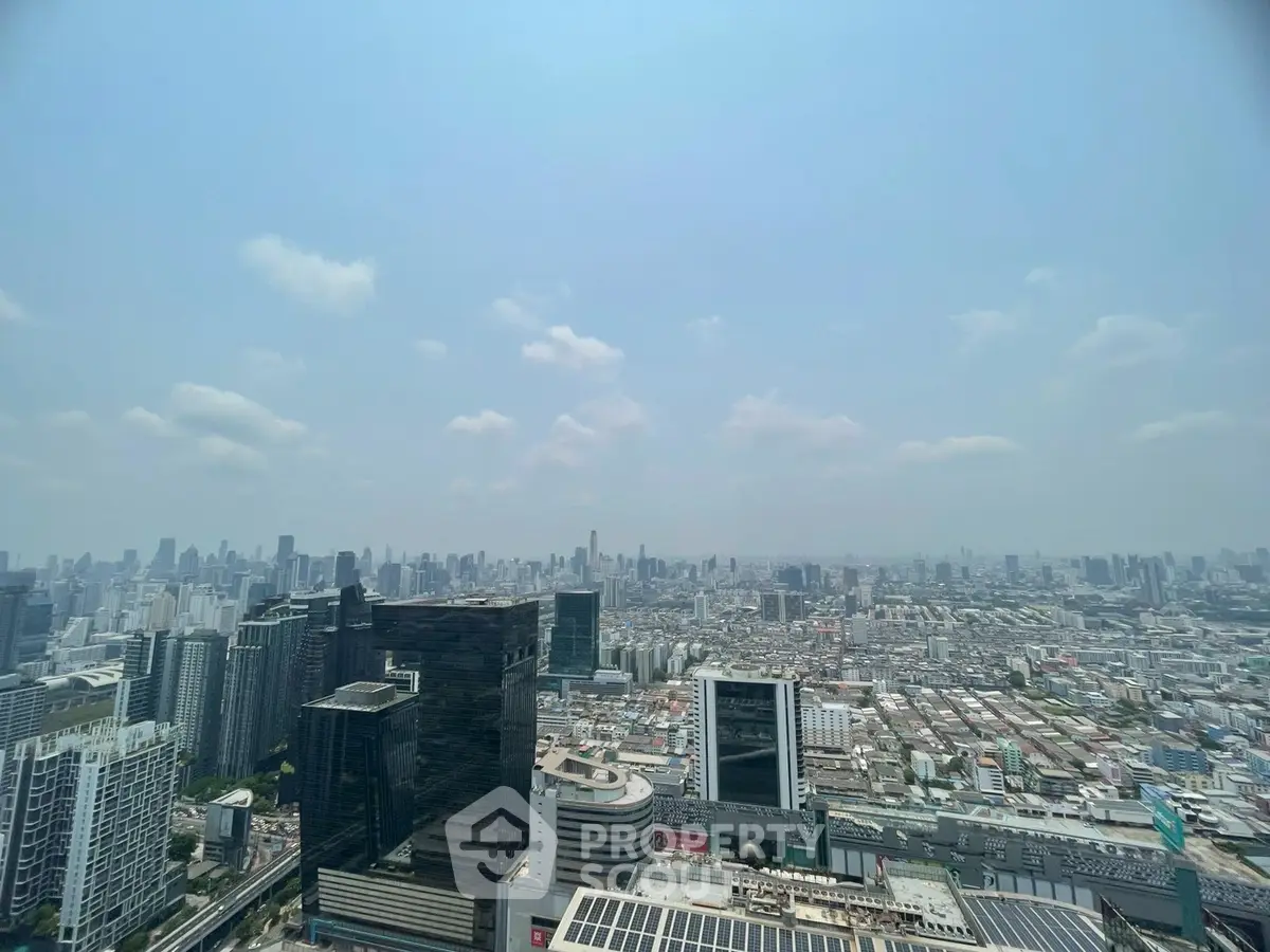 Stunning panoramic cityscape view from a high-rise building, showcasing urban skyline and architectural diversity.