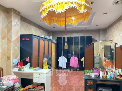 Spacious bedroom with elegant wardrobe and unique ceiling decor