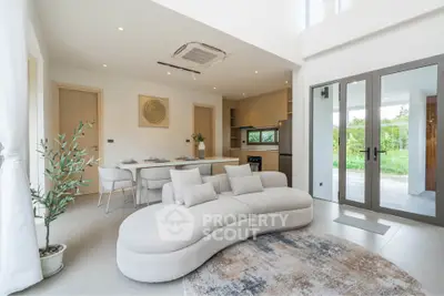 Modern open-plan living room with stylish furniture and natural light