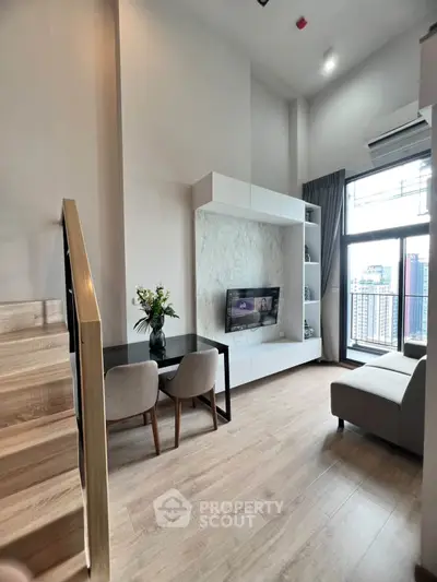 Modern living room with high ceiling and city view, featuring stylish furniture and natural light.