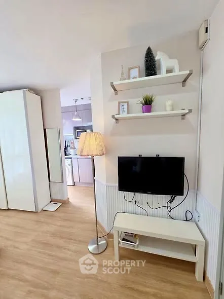 Modern living room with stylish decor and open view to kitchen area