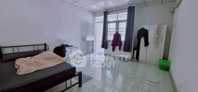 Spacious bedroom with minimalist decor and natural light