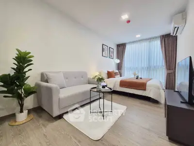 Modern studio apartment with cozy living area and stylish decor