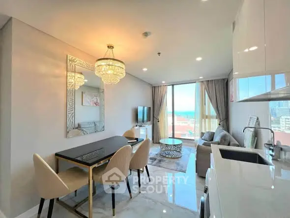 Luxurious modern living room with elegant dining area and stunning sea view.