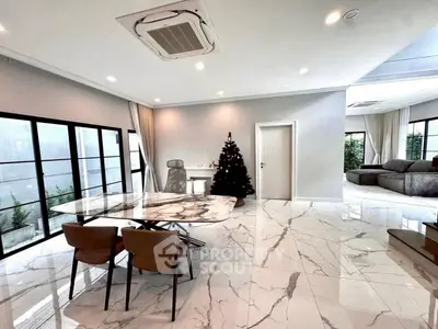 Luxurious open-plan living room with marble flooring and modern decor