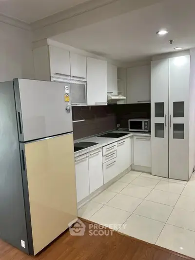 Modern kitchen with sleek appliances and ample storage space