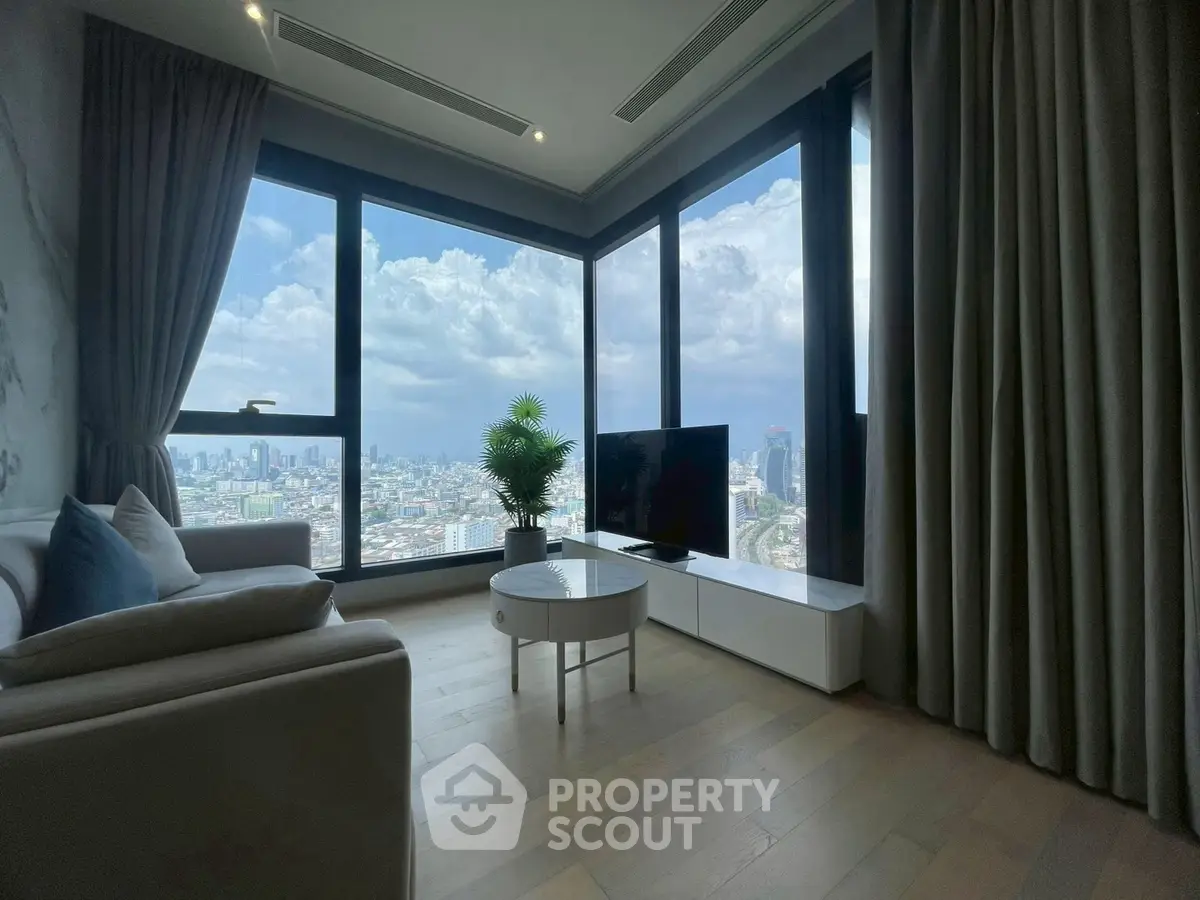 Stunning corner unit living room with panoramic city views and modern decor.