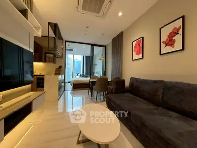 Modern living room with sleek design and open kitchen layout