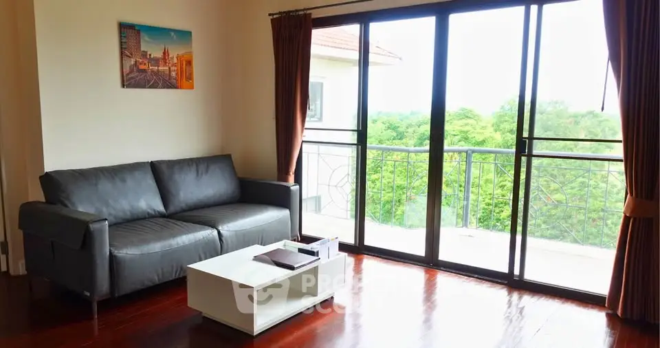 Charming living room with balcony and scenic view