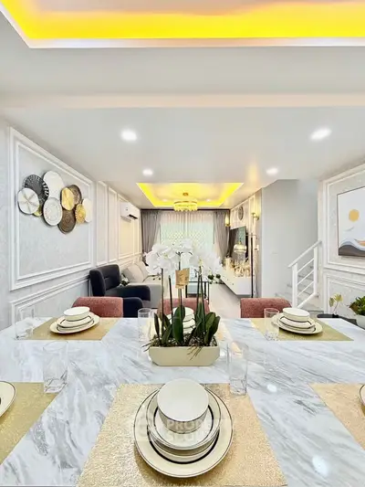 Luxurious modern living room with elegant dining setup and stylish decor