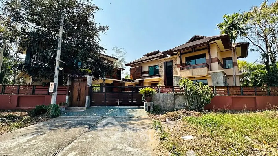 Stunning two-story house with lush garden and spacious driveway in serene neighborhood.