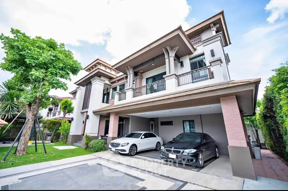 Luxurious modern house with spacious driveway and elegant architecture in a serene neighborhood.