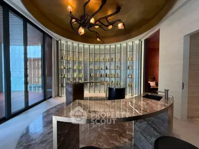 Luxurious modern interior with marble floors and unique lighting, perfect for upscale living or entertaining.
