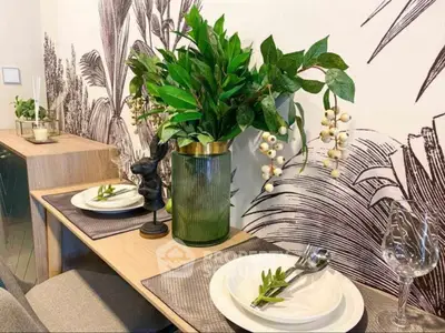 Stylish dining area with elegant table setting and lush greenery decor