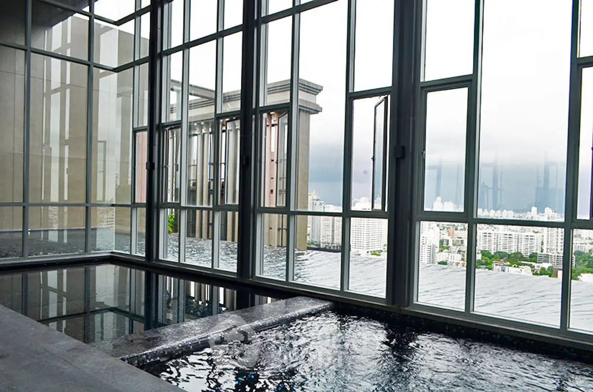 Luxurious rooftop infinity pool with stunning city skyline views