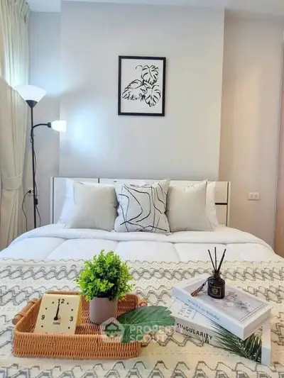 Cozy bedroom with modern decor, stylish bedding, and elegant lighting for a serene ambiance.