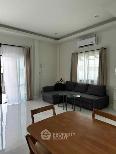 Modern living room with sleek furniture and natural light