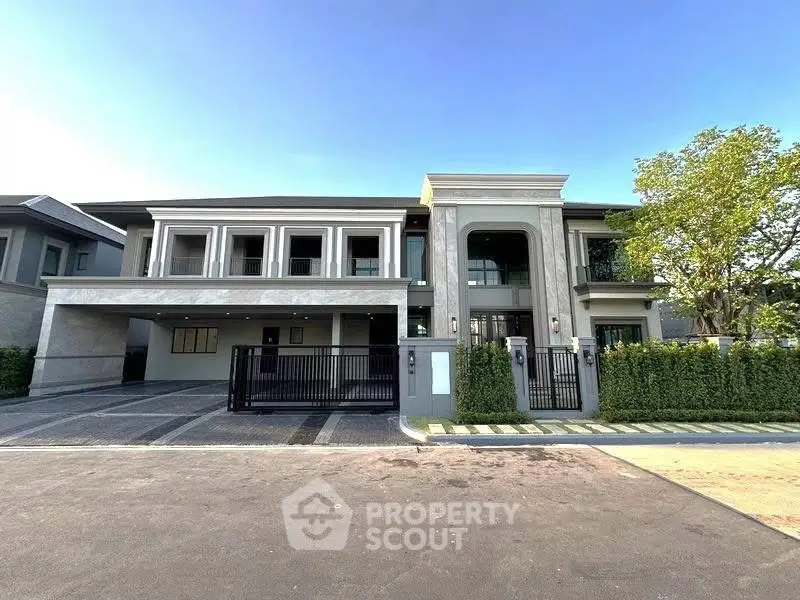 Luxurious modern mansion with grand entrance and spacious driveway