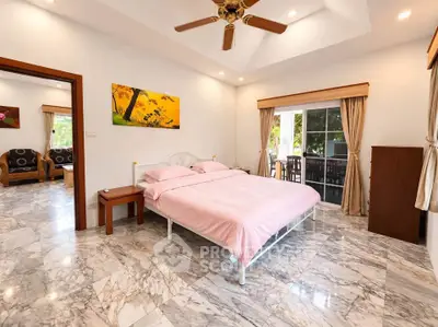 Spacious bedroom with marble flooring and elegant decor in a luxury home.