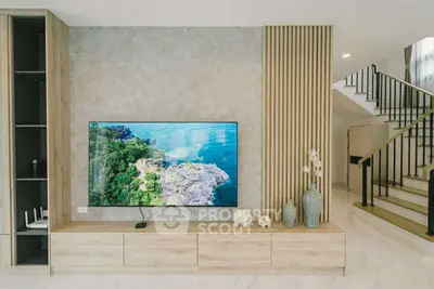 Modern living room with stylish TV setup and elegant decor