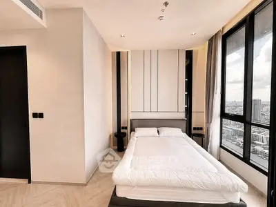 Luxurious bedroom with panoramic city view and modern minimalist design.